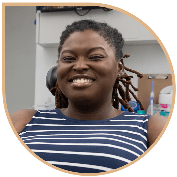 lady stripped shirt smiles dental work