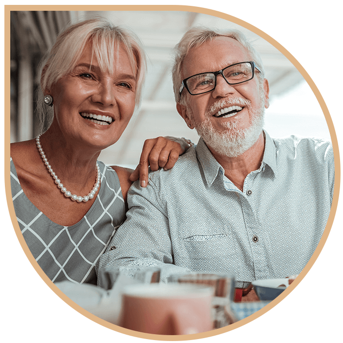 married couple after dental implant success